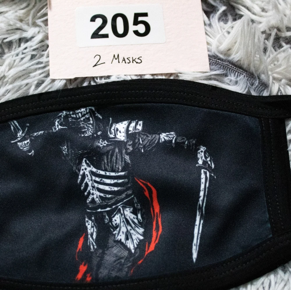 Black cloth face mask featuring a medieval warrior graphic